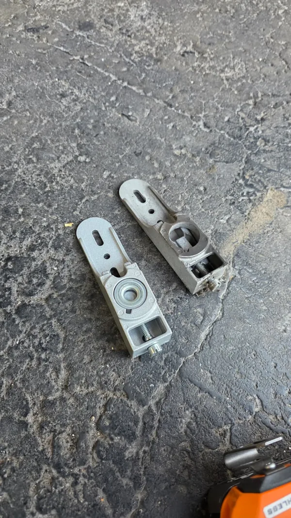 Two commercial door pivot components placed side by side